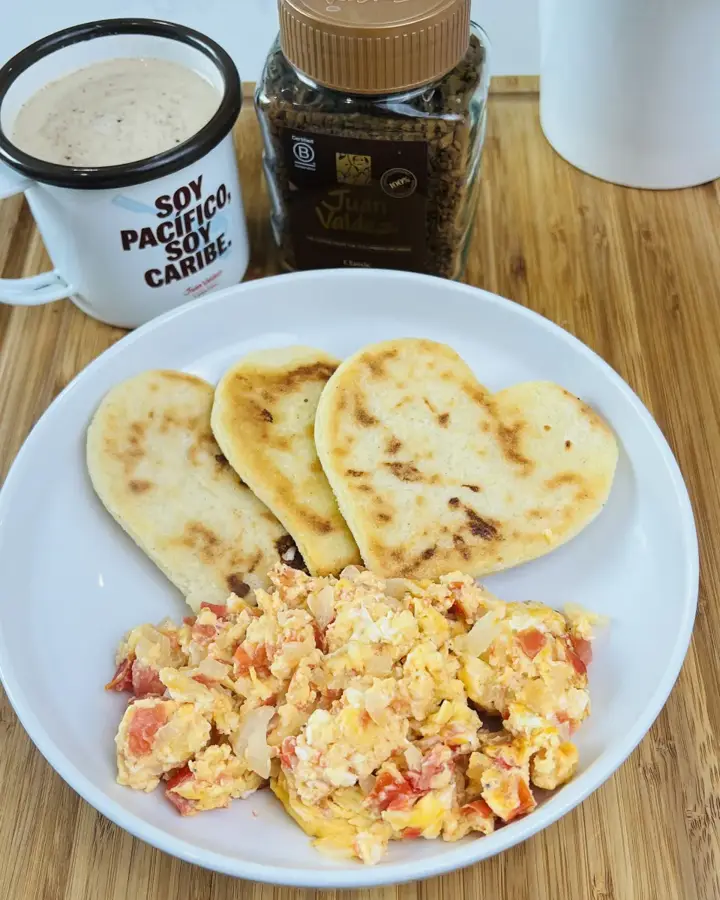 Arepas, scrambled eggs and Colombian coffee